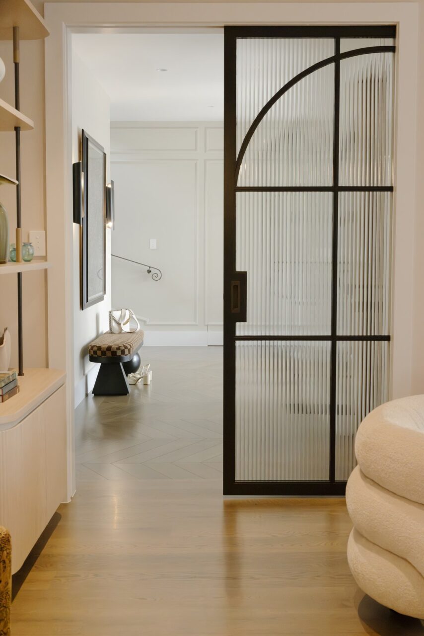 Wall St Designs - hallway with a black steel-framed interior door in Palmerston North